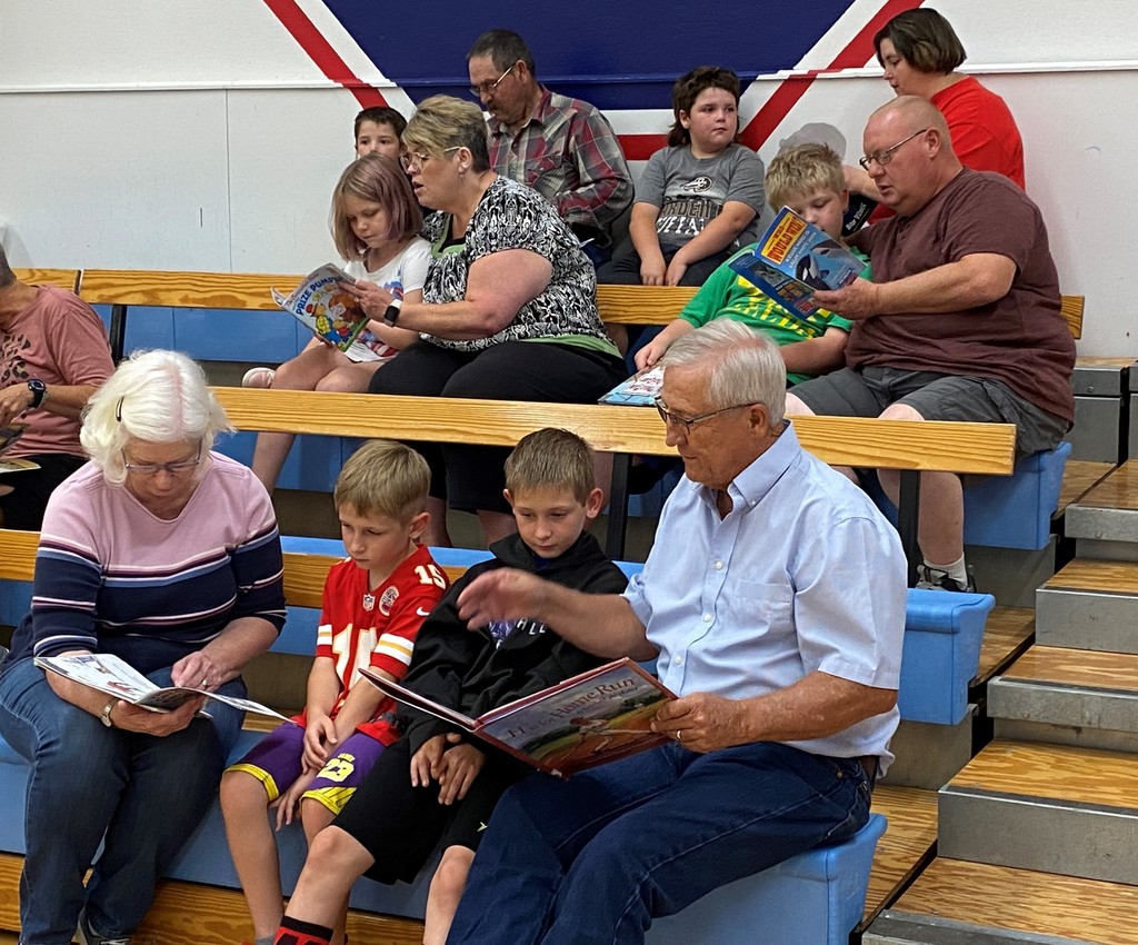 grandparents reading to child