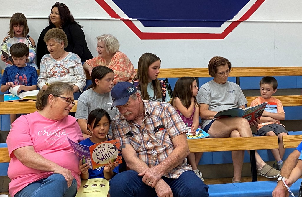 grandparents reading to child